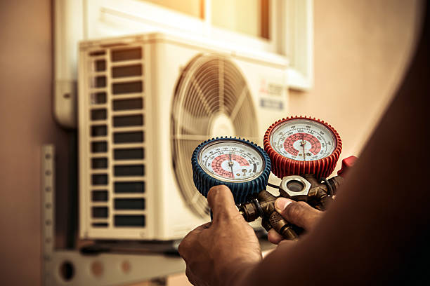 Professional Air Conditioning Service technician working in White Lake, MI